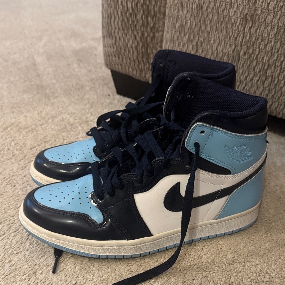 UNC Jordan Blue and Black High-Top Sneakers